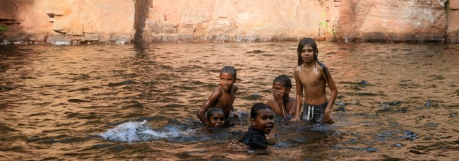Tess Atie's family swimming at Florence Falls in Litchfield National Park, Northern Territory